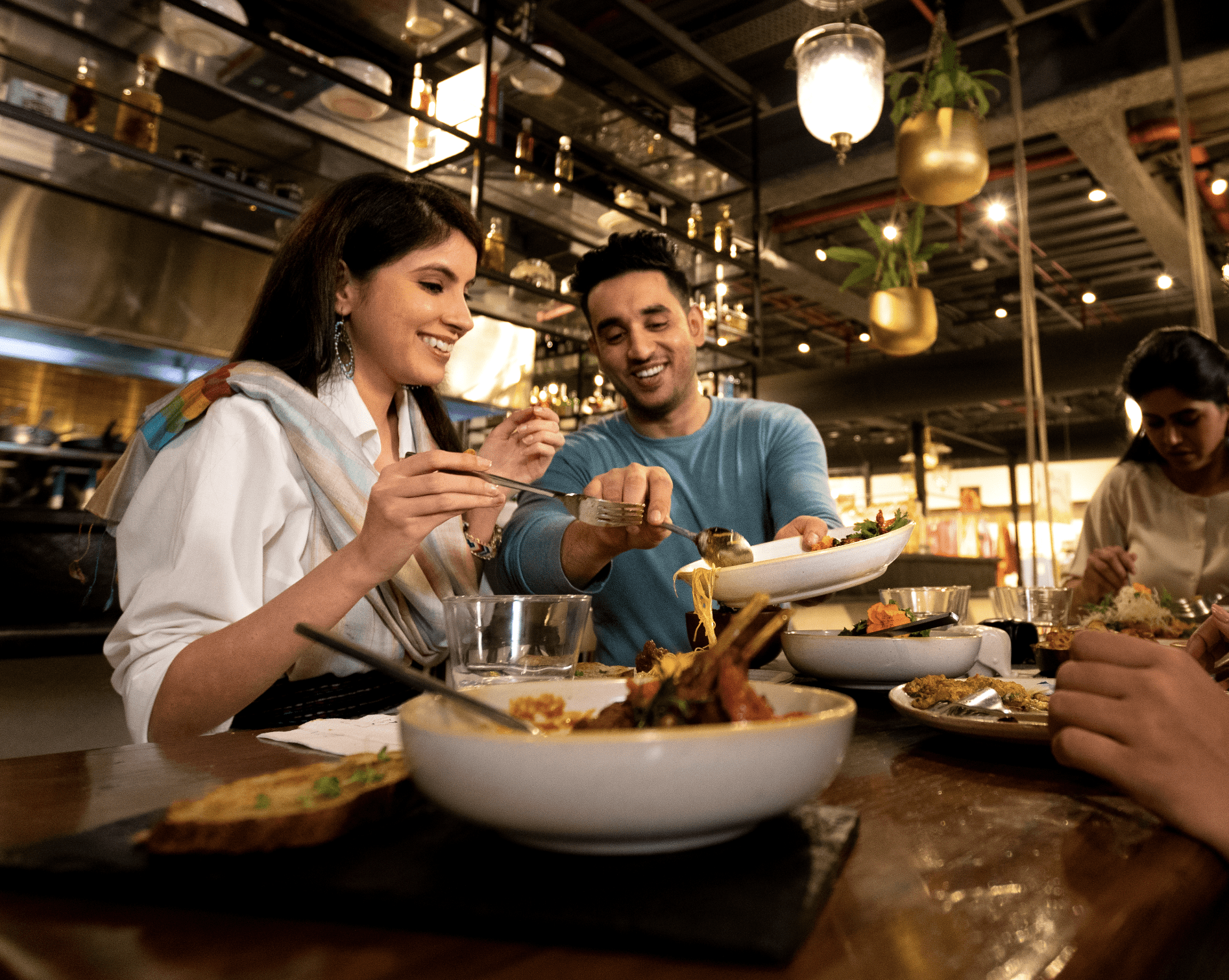 Man and woman sharing food at a restaurant_NewDelhi-1422 (1)