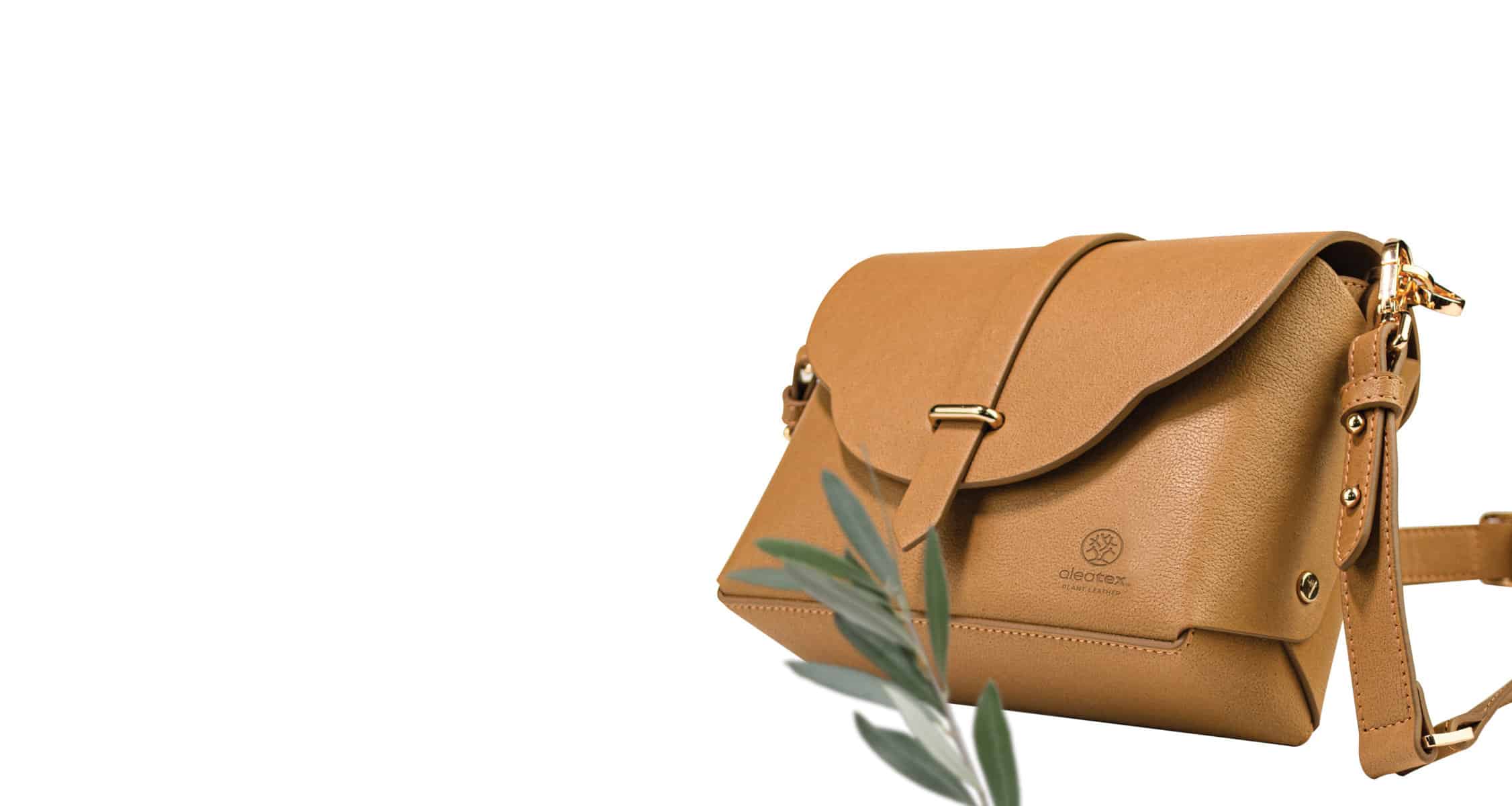 a brown handbag made with olive leather