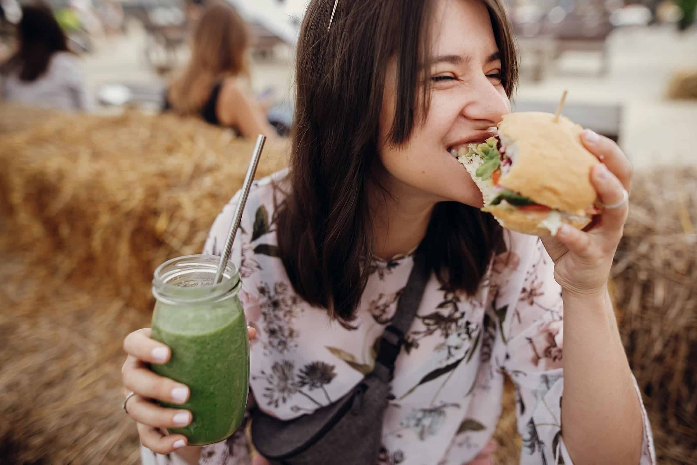 Girl eating plant-based healthy burger